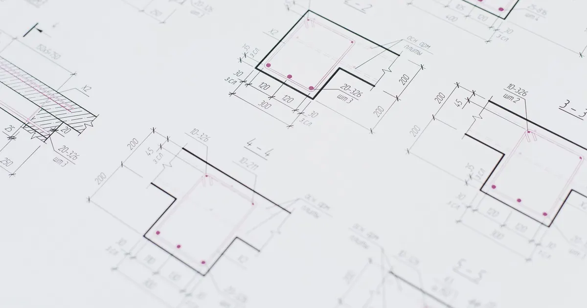Technical drawing with dimensioned views on white paper, used to explain JIS geometric tolerance symbols